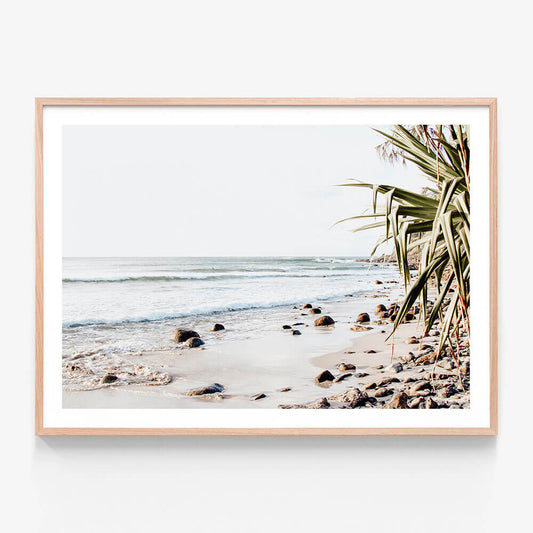 A framed photo wall art print featuring
the beach at Byron Bay in the evening wall art print in oak frame