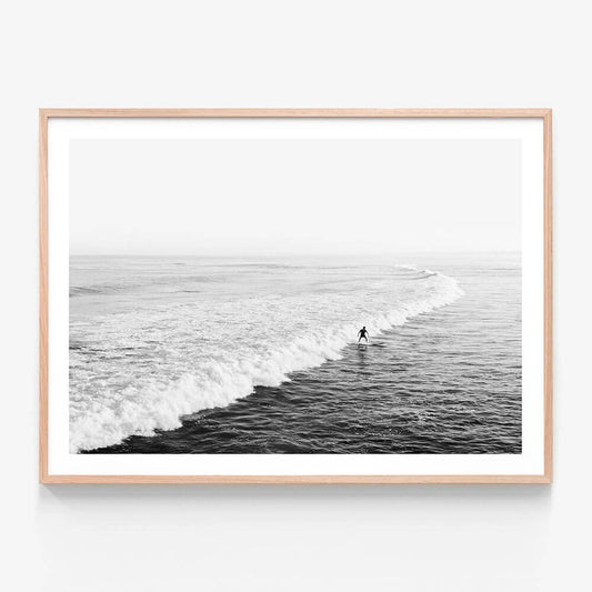 Solo Surfer BW wall art print in oak frame