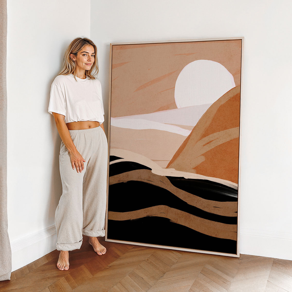 Woman standing next to a large canvas wall art prints