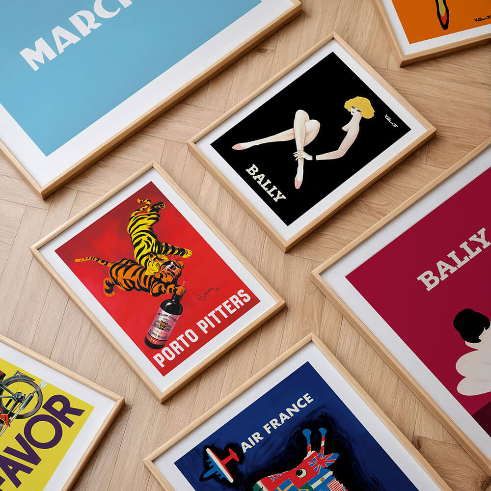 A collection of vintage poster framed prints and wall art.