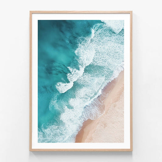 A framed photo wall art print featuring an overhead beach coastal scene