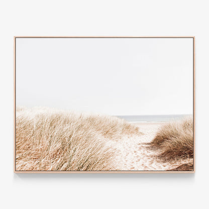 A coastal photo of beach grass  by the ocean canvas wall art print with oak float frame