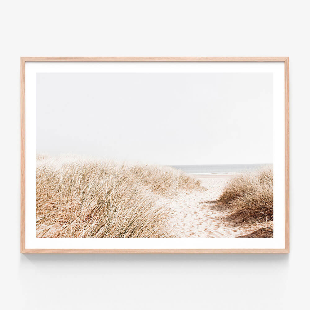 A coastal ramed artwork print depicting a beach grass landscape with a soft neutral color palette.