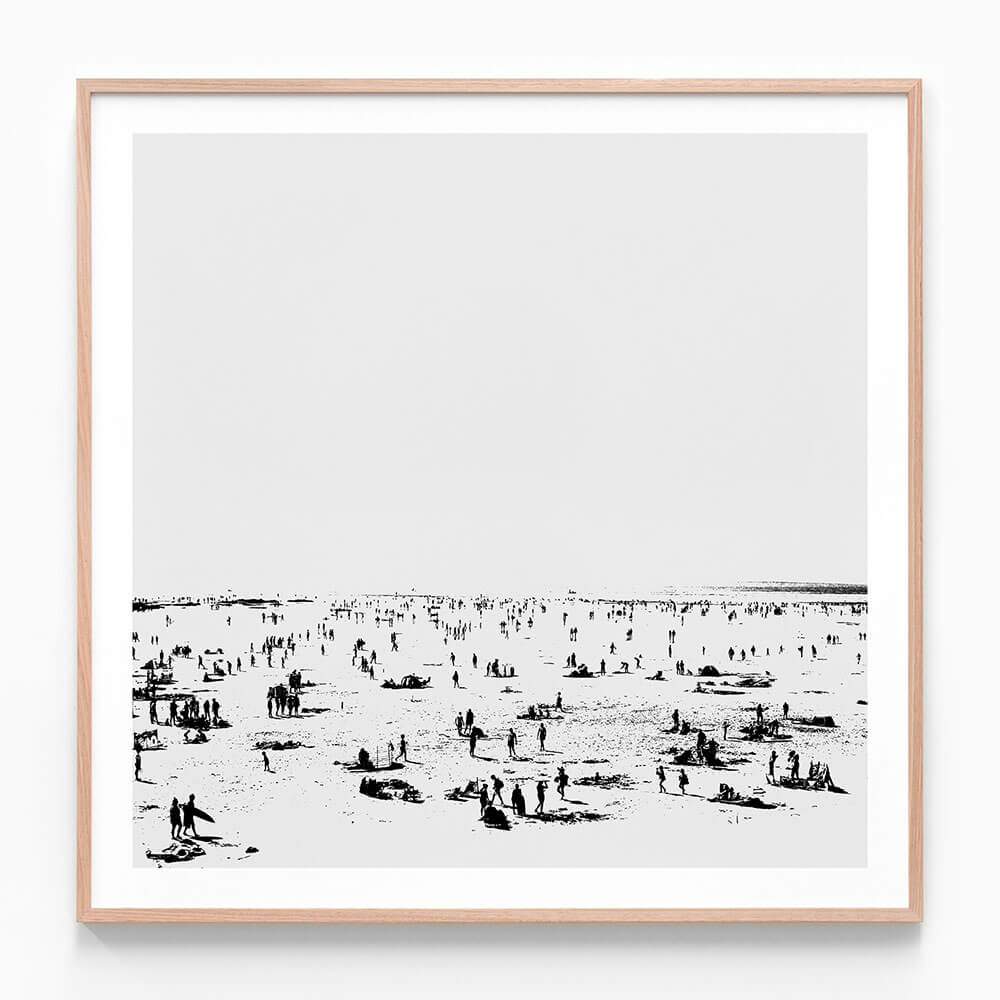 A framed black and white photo wall art print featuring the beach