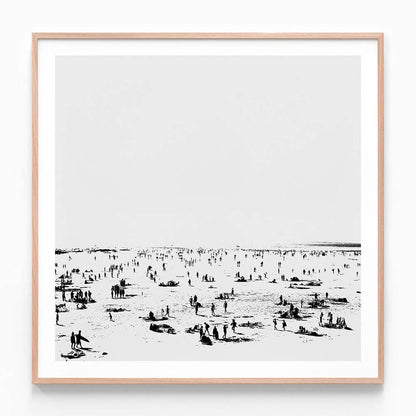 A framed black and white photo wall art print featuring the beach