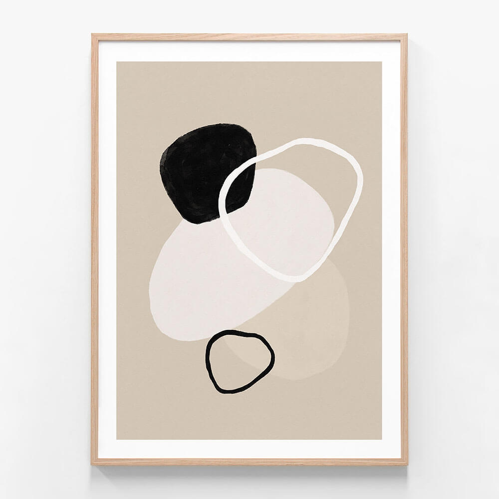A minimalist framed artwork featuring abstract shapes in black, white, and beige colors on a neutral background.