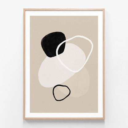 A minimalist framed artwork featuring abstract shapes in black, white, and beige colors on a neutral background.
