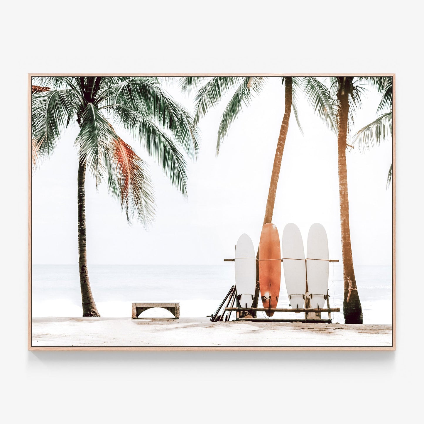 Surfboards on a rack under palm trees on a tropical beach photo canvas wall art with oak float frame