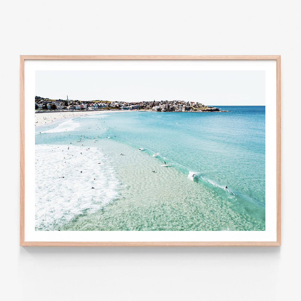 A framed wall art print featuring an overhead photo of Bondi Beach