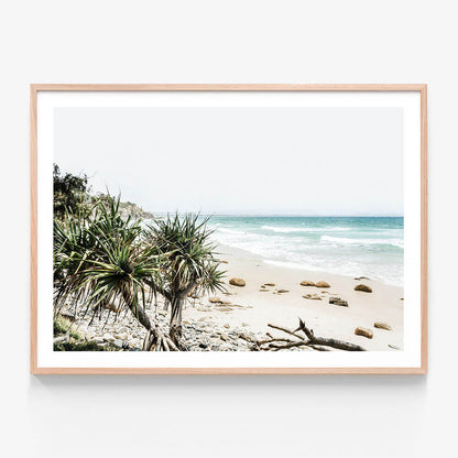 A framed print featuring the beach at Byron Bay Australia.
