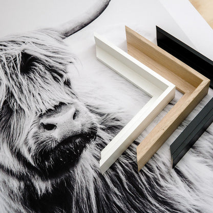 A selection of picture frame mouldings for canvas art prints on a table in our Geelong studio.