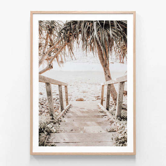 A framed photo wall art print featuring steps leading down the beach of the Australian coast