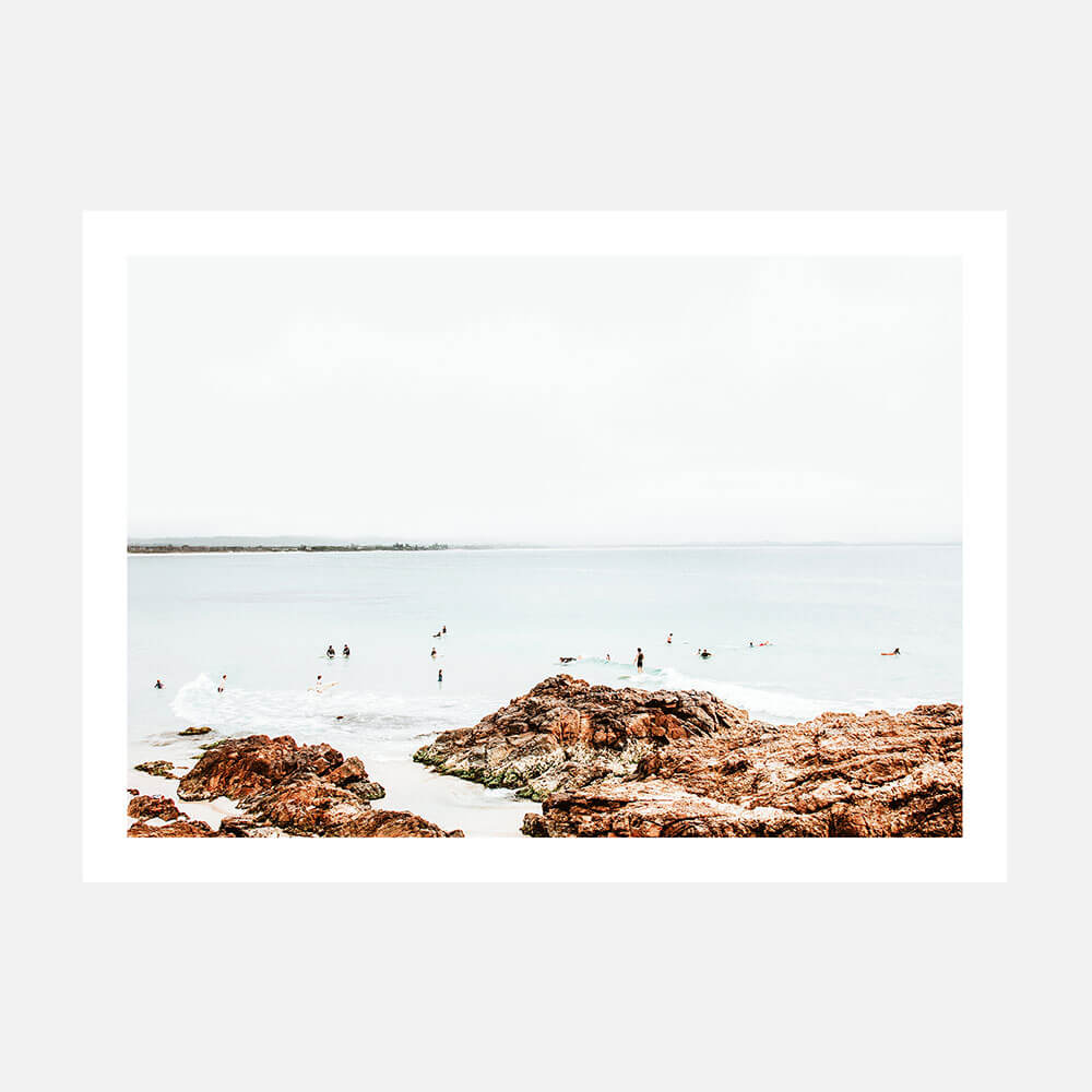 A photo wall art print featuring surfers at the pass in Byron Bay