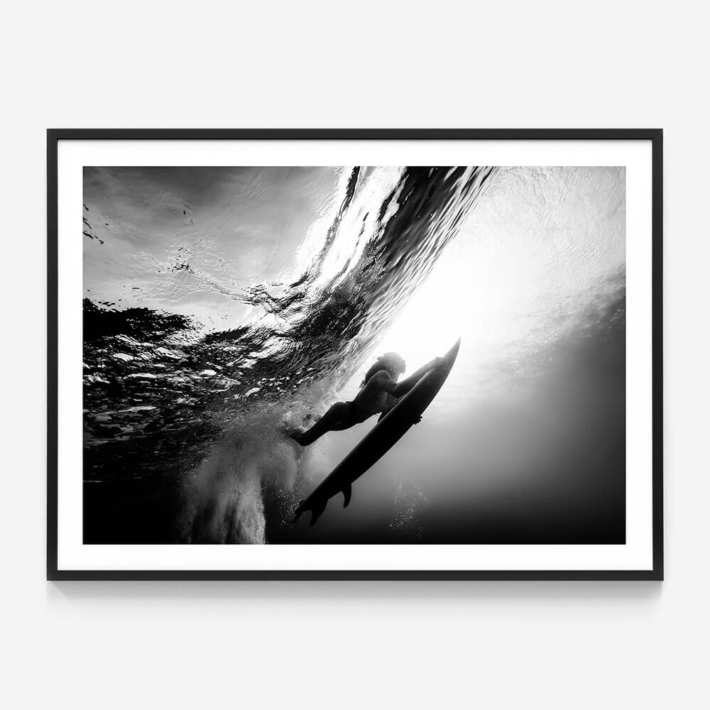A surfer Duck Diving under a wave Framed Print Black & White Photography Print