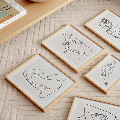 A collection of female line art illustration Framed Prints.