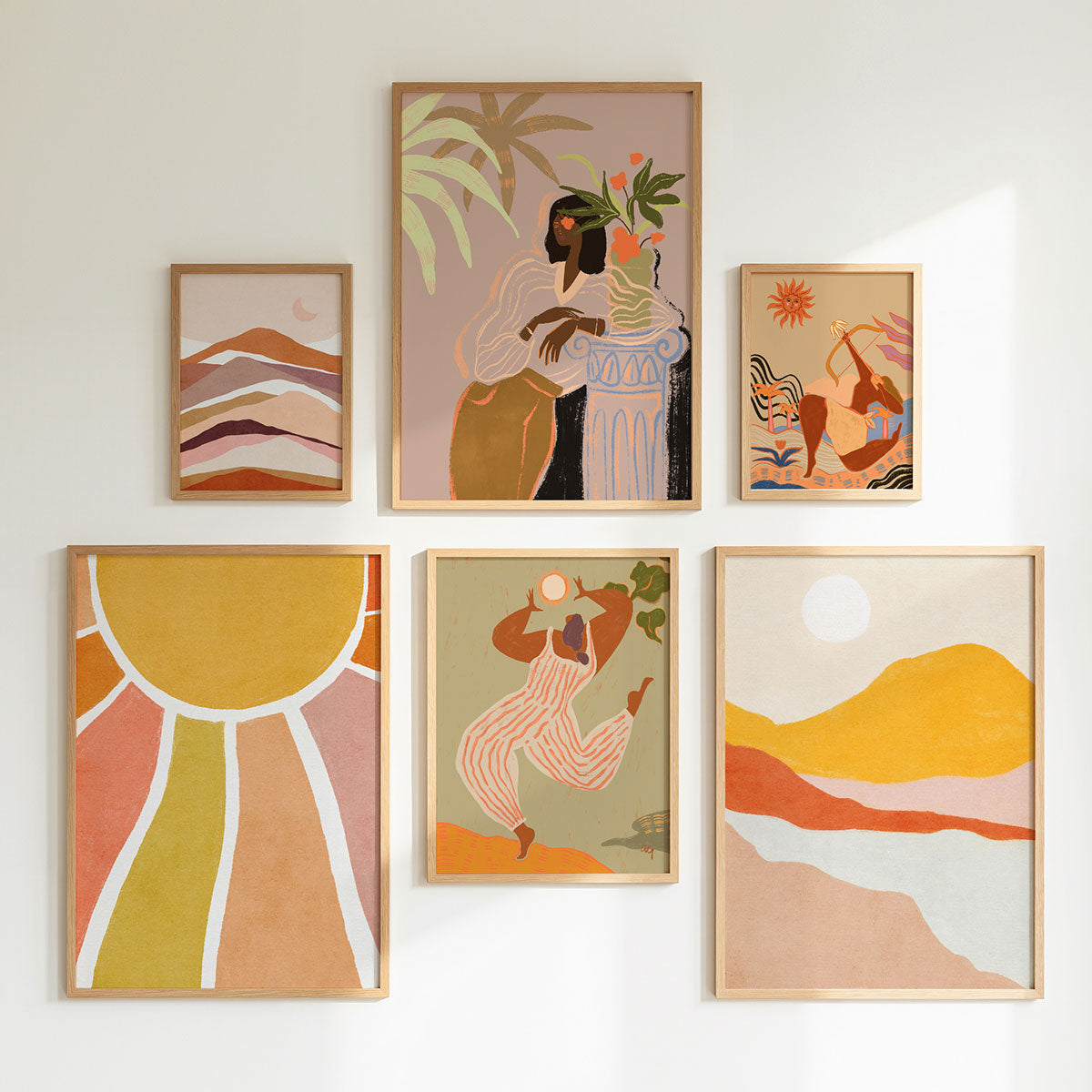 Set of six boho style artworks in wooden frames arranged in a gallery wall layout.