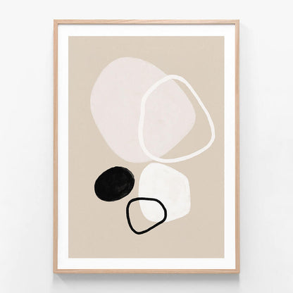 A minimalist framed artwork featuring abstract shapes in beige, black, and white colors.
