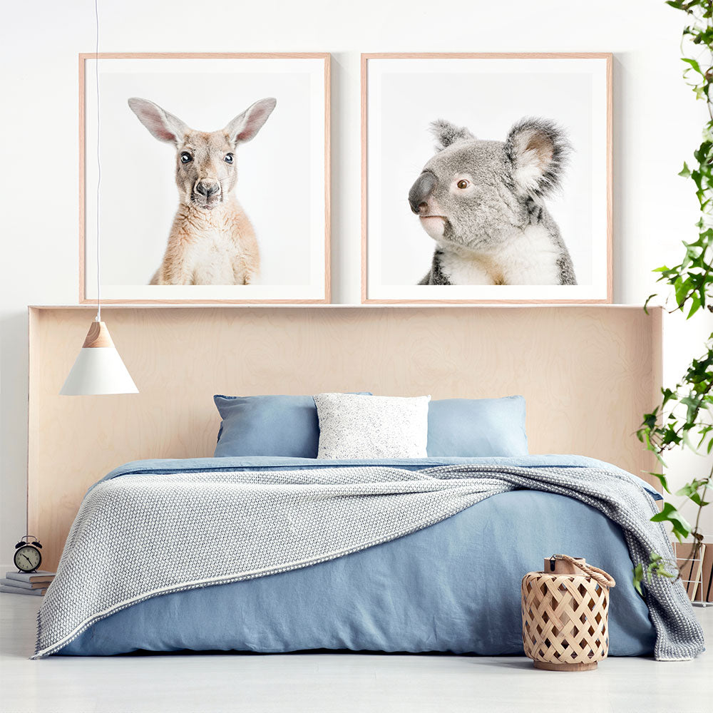 Kids framed prints of a kangaroo and a koala in a nursery room.