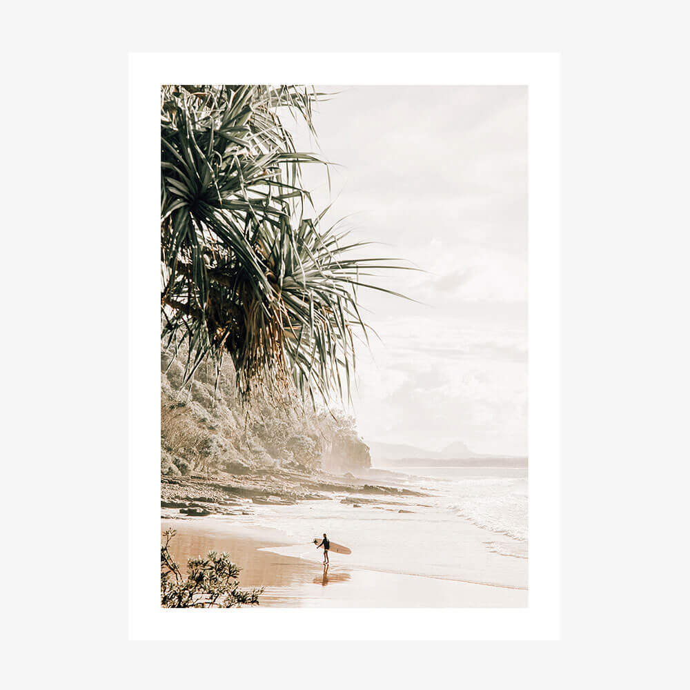 A photo wall art print featuring a surfer on the beach in Noosa 