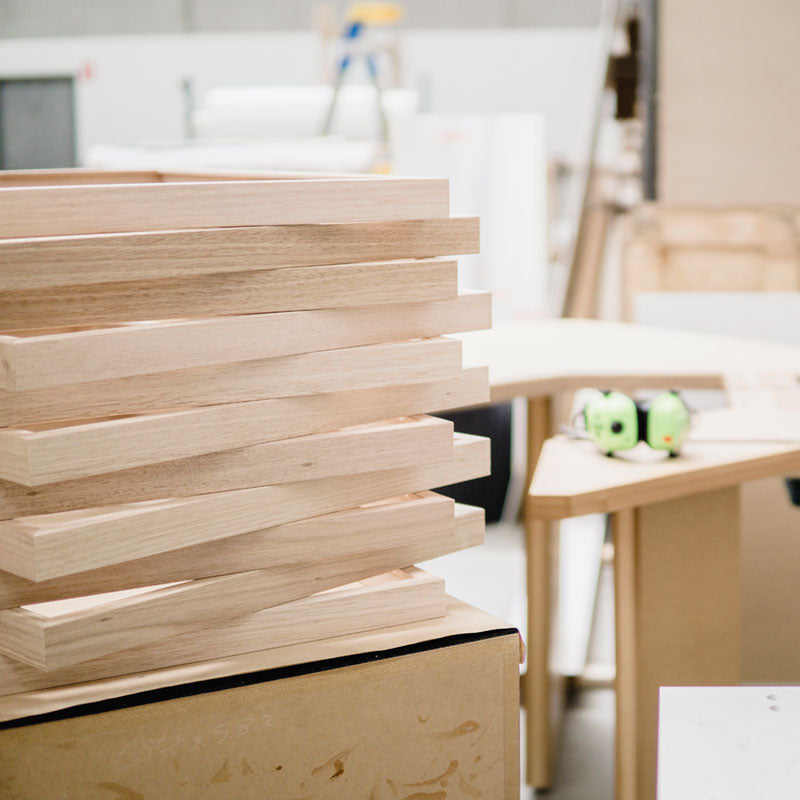 Stack of oak wall art frames in our Geelong workshop.