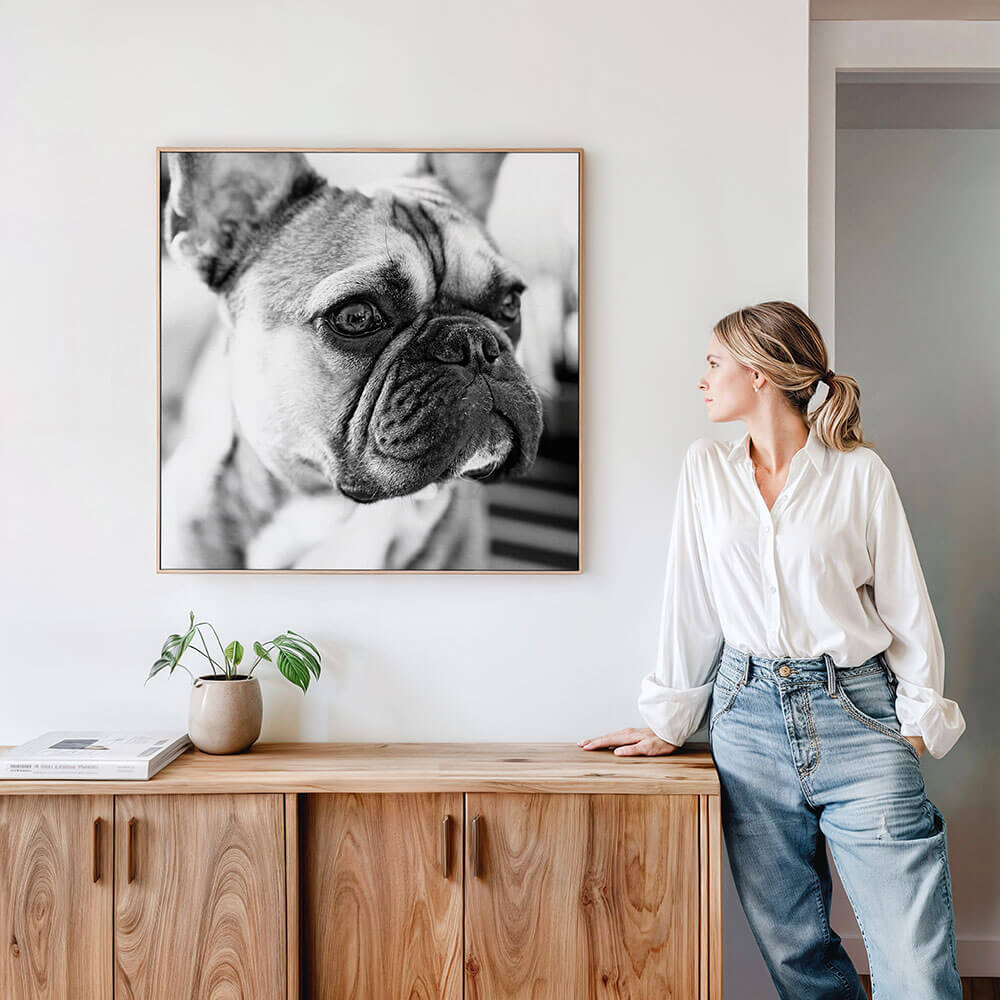 A framed canvas wall art print of a pet that she bought online and got framed.