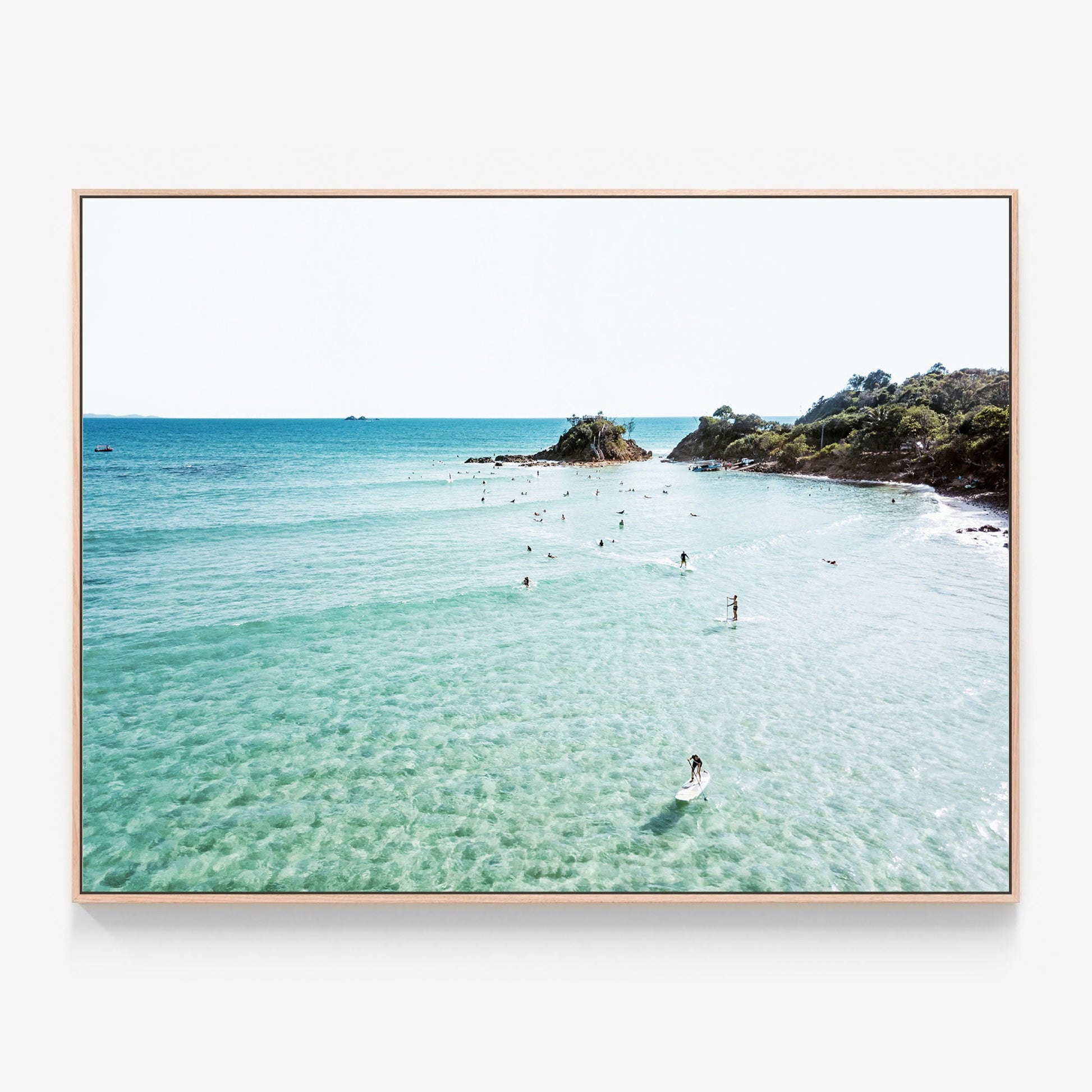 Paddle Boards on the beach at Byron Bay Canvas photo print in oak frame