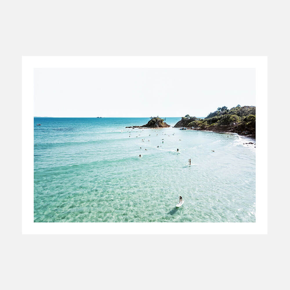 A photo wall art print of surfers at Byron Bay