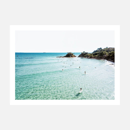 A photo wall art print of surfers at Byron Bay