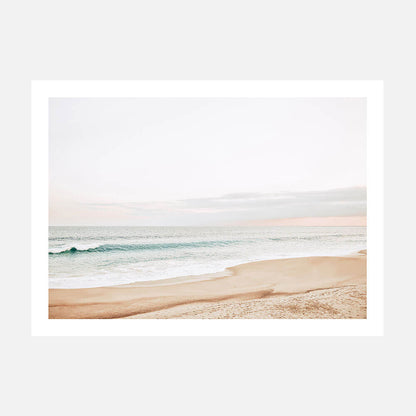 A pastel-colored photography art print of a coastal scene with a beach and ocean waves in the background.