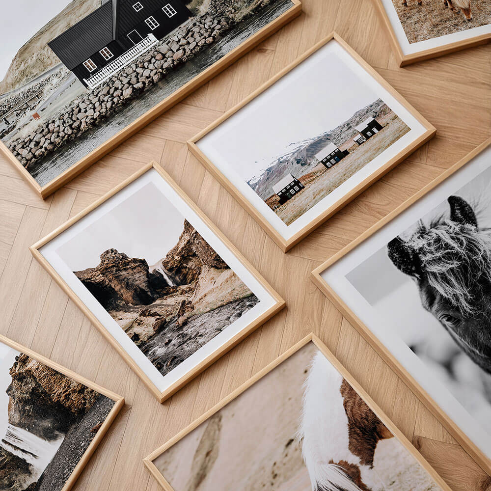 A collection of scandinavian framed prints.