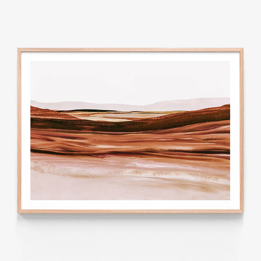 An abstract landscape painting in tones of sienna and pink. Framed in oak.