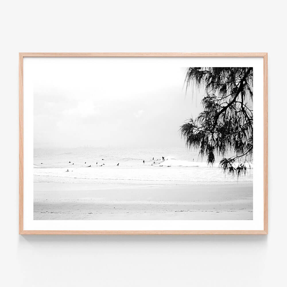 A framed photo wall art print featuring Snapper Rocks beach in black and white 