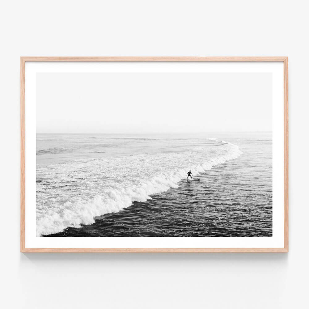 Solo Surfer BW wall art print in oak frame