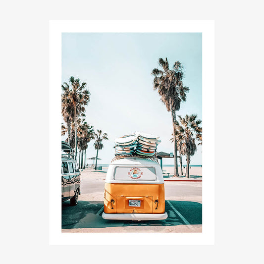A photo wall art print featuring a surf van with surfboards by the beach