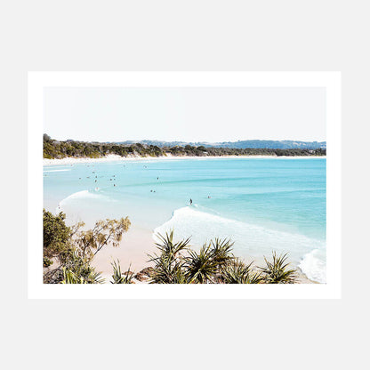 A photo poster print featuring surfers at the pass in Byron Bay Australia.