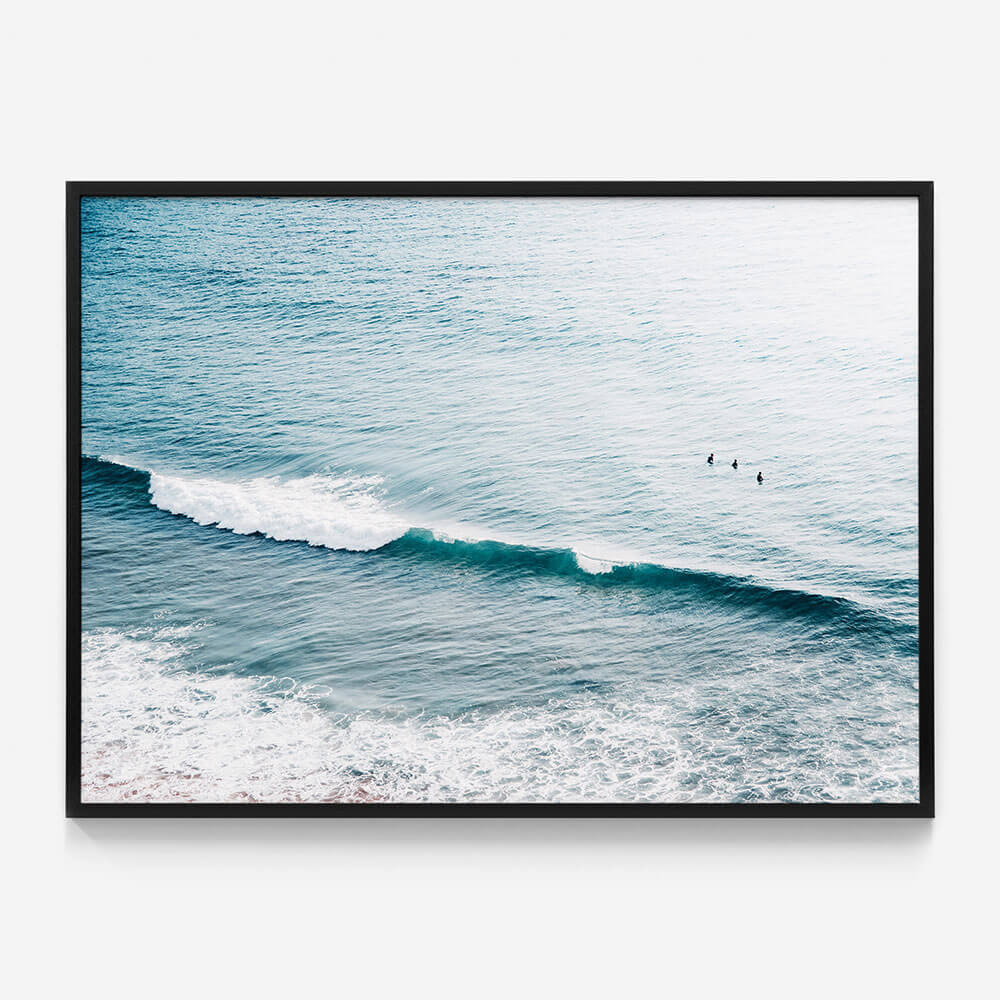 Three Surfers