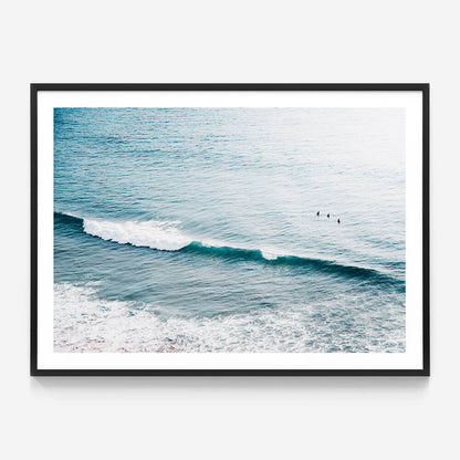 Three Surfers