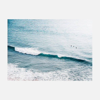 Three Surfers