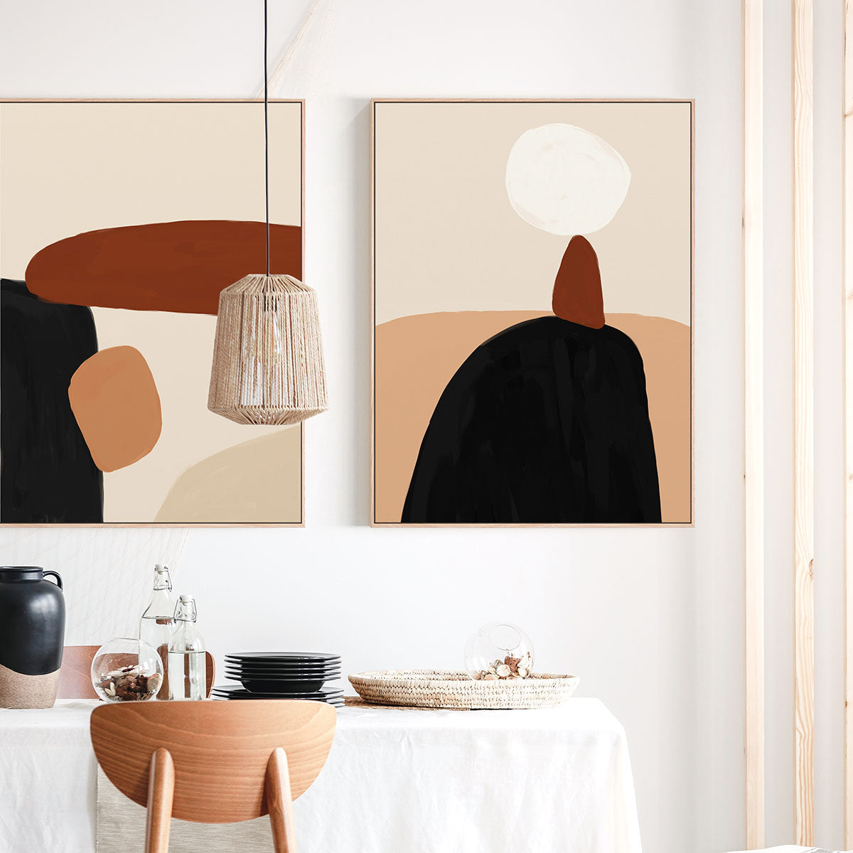 Abstract wall art in a modern interior setting with a table and chairs.