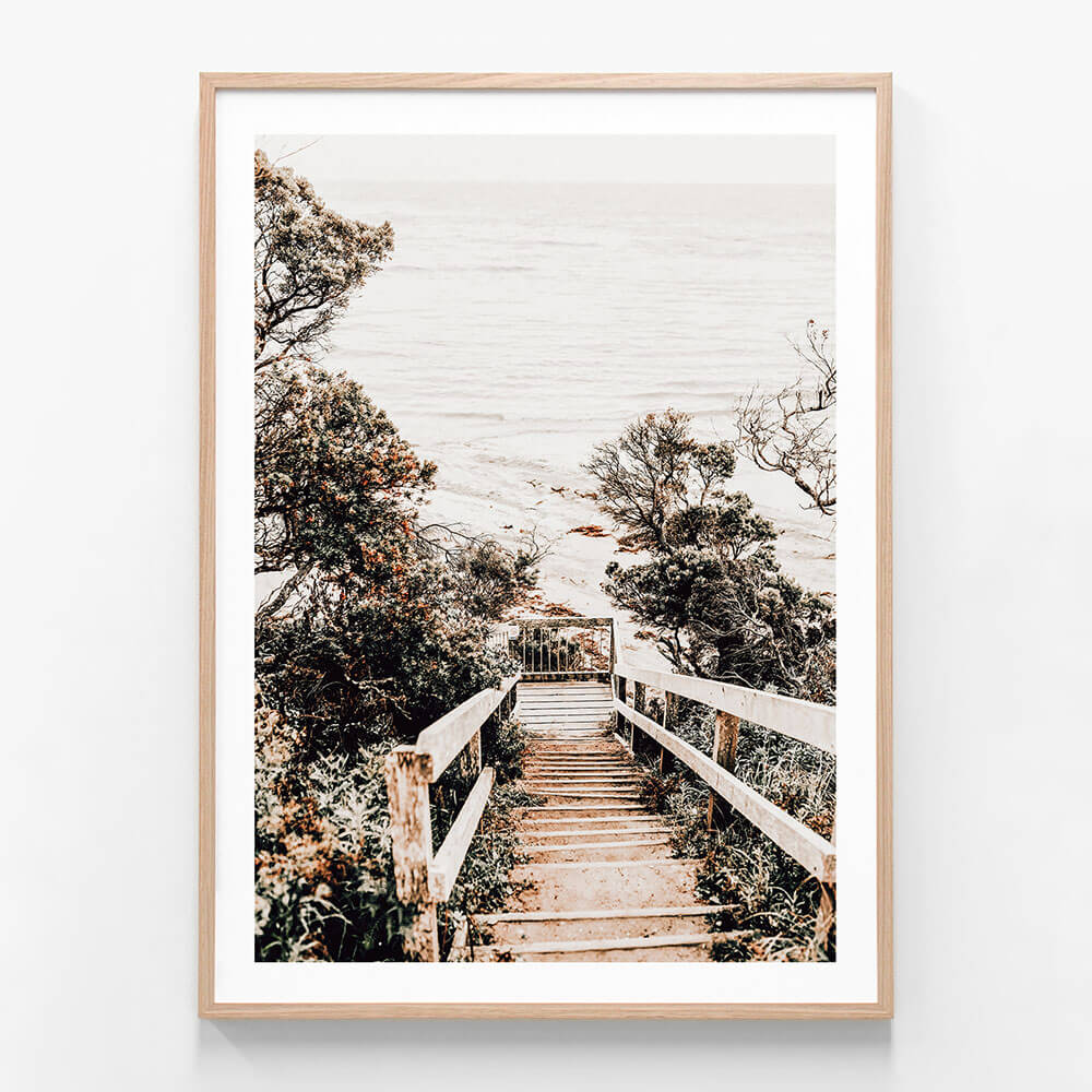 A coatal framed photo wall art print featuring wooden steps down to the beach